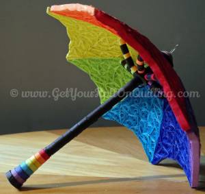<a href="http://www.getyourrollonquilling.com/portfolio/le-parapluie-umbrella/"><b>Umbrella top to bottom</b></a>